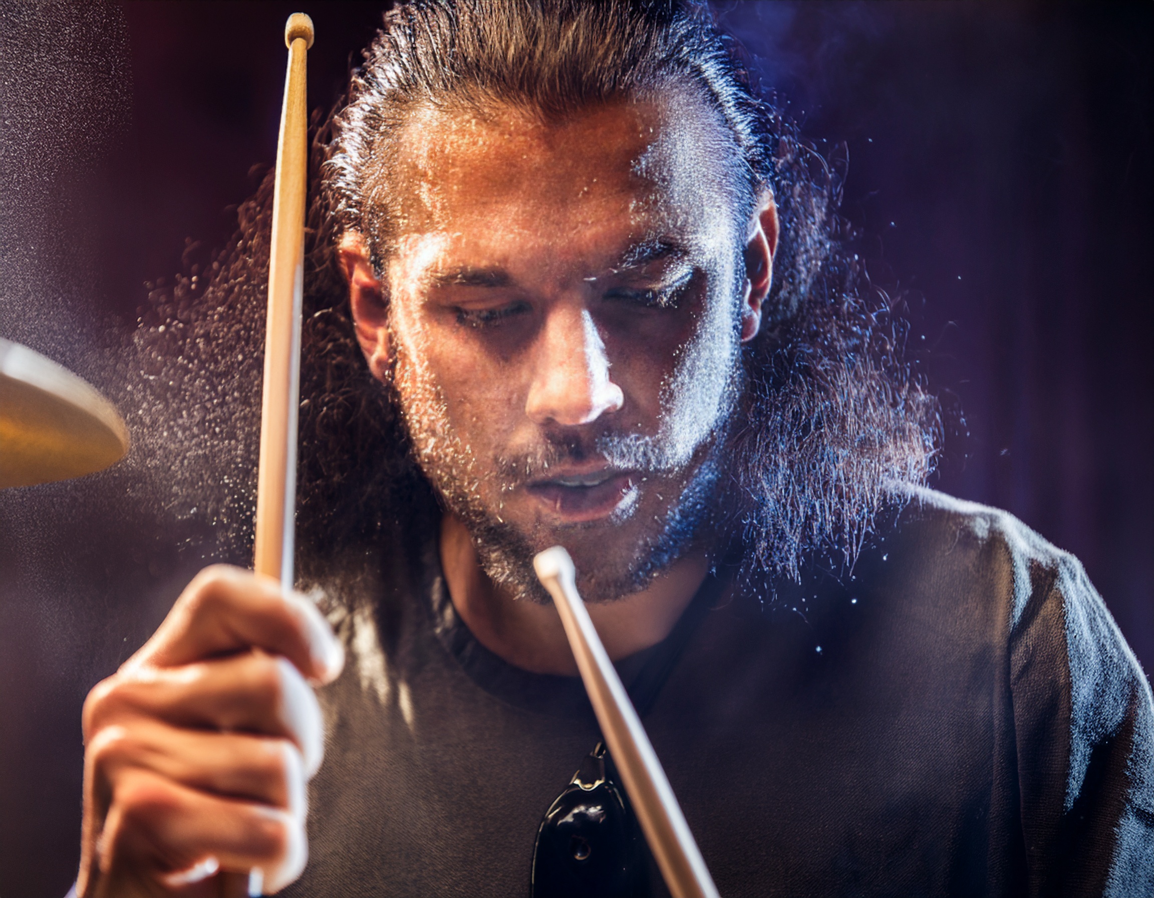 A man drumming with the best sticks on the market